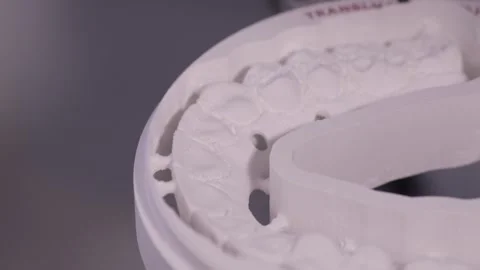 A CNC dental milling machine produced the shape of the artificial teeth. Video stock 269074722