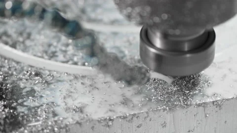 The CNC drill bit drills a hole in a flood aliminium shape in circular motion Stock Footage 167430441