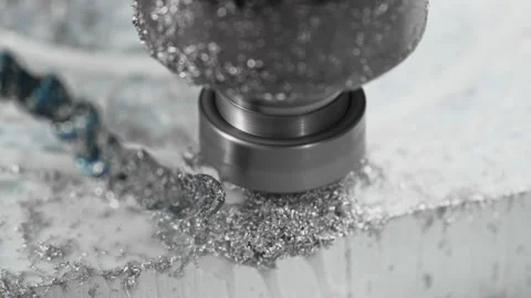 The CNC drill bit drills a hole in a flood aliminium shape in circular motion Stock-Footage 167506915