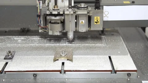CNC engraving and cutting machine milling a metal board, dolly shot Stock Footage 101258111