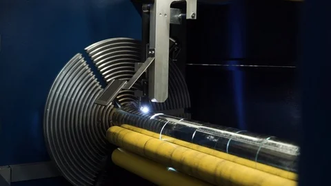 The CNC fiber laser cutting machine cutting the stainless tube,pipe for make Stock Footage 128075939
