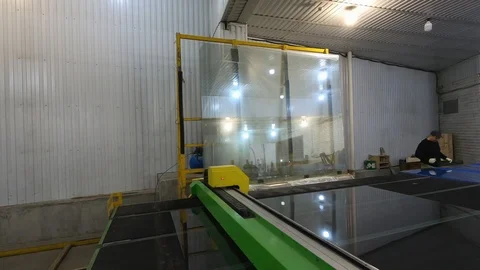 CNC glass cutting machine at work.Automatic cutting of the glass on the table. Stock Footage 124121368