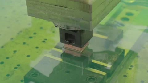 CNC industrial machining using electrical charges in green liquid to build Stock Footage 289751420