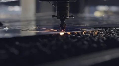 CNC Laser cutting of flat sheet metal steel material on a lathe with the program Stock Footage 102440681