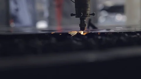 CNC Laser cutting of flat sheet metal steel material on a lathe with the program Stock Footage 102440938