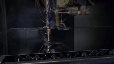 CNC Laser cutting of flat sheet metal steel material on a lathe with the program Stock Footage 103451593