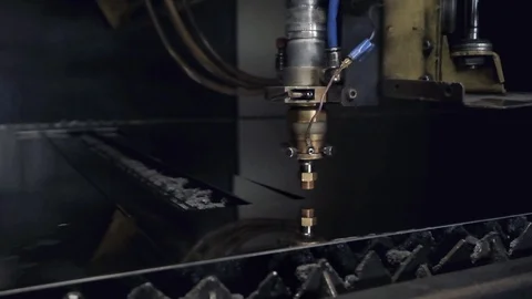 CNC Laser cutting of flat sheet metal steel material on a lathe with the program Stock Footage 103451633