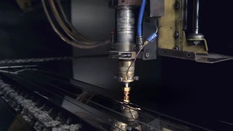 CNC Laser cutting of flat sheet metal steel material on a lathe with the program Stock Footage 103451763