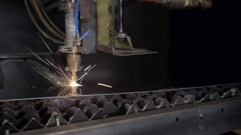 CNC Laser cutting of flat sheet metal steel material on a lathe with the program Stock Footage 103451824