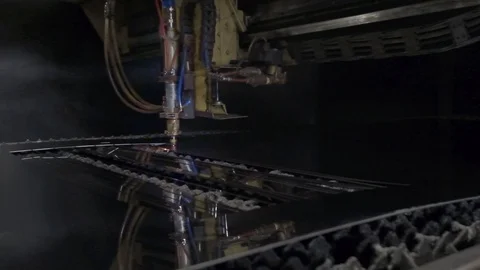 CNC Laser cutting of flat sheet metal steel material on a lathe with the program Stock Footage 103451887