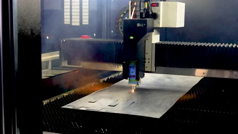 CNC  laser cutting machine cutting metal sheet in a factory Stock Footage 168169117