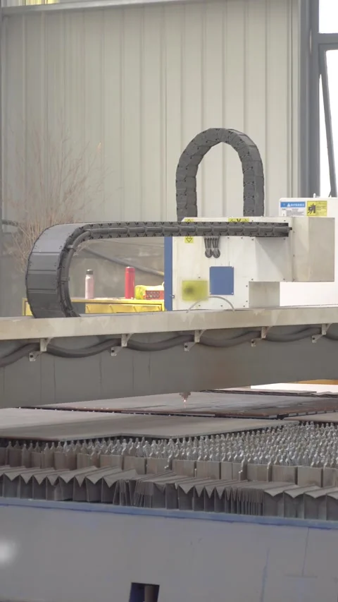 CNC Laser Cutting Machine Processing Steel Plate in Modern Metal Fabrication Stock Footage 339384417