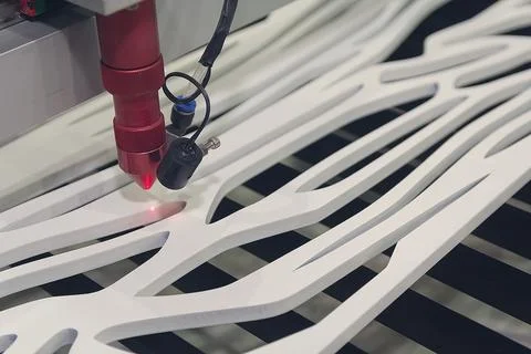 Cnc Laser cutting machine at work. Acrylic plastic cutting. Industry Stock Photos