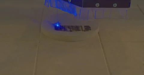 CNC laser engraver applies an abstract pattern to a wooden panel Stock Footage 213920729