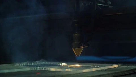 A cnc laser machine cuts a part from organic plastic. Stock Footage 145867227