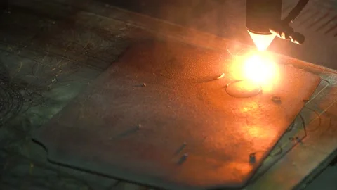 A cnc laser machine cuts a part from a piece of steel. Stock Footage 145867334