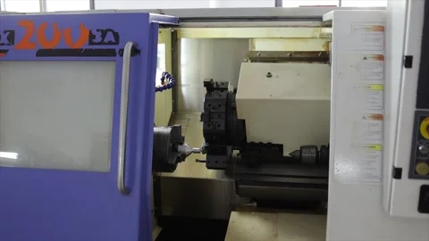 CNC Lathe Machine Close Up Showing Spindle and Turret in Metalworking Stockbeeldmateriaal 332143755