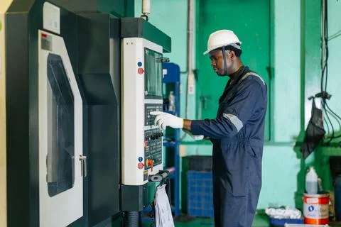 CNC Lathe Machine Engineer Operator Worker Working Entering Work Batch Prod.. Stock Photos