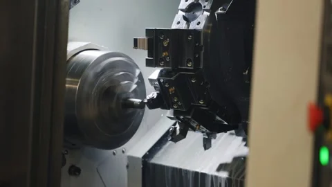 CNC Lathe Machining Process Inside Industrial Metalworking Machine Stock Footage 337189960