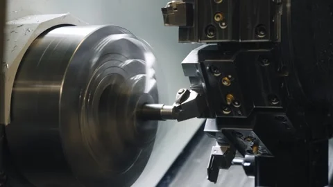 CNC Lathe Machining Process Inside Industrial Metalworking Machine Stock Footage 337190068