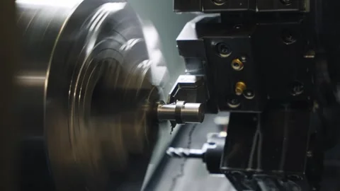 CNC Lathe Machining Process Inside Industrial Metalworking Machine Stock Footage 337190155