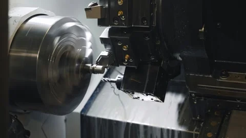 CNC Lathe Machining Process Inside Industrial Metalworking Machine Stock Footage 337190374