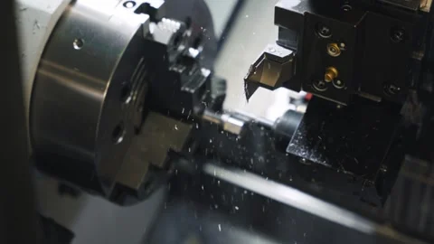 CNC Lathe Machining Process Inside Industrial Metalworking Machine Stock Footage 337191628