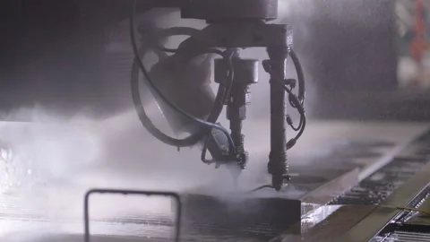 CNC machine attachment cuts out the product under high pressure with water Stock Footage 313997424