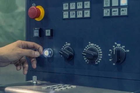 CNC Machine control panel with hand the press. Stock Photos