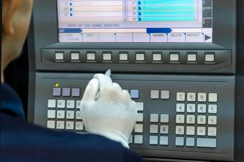 CNC Machine control panel with hand the press. Foto stock