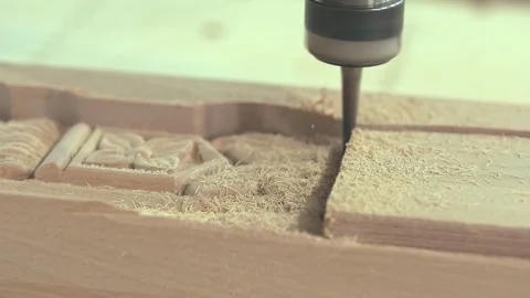 CNC machine cutting a decorative shape in a wooden part. Close-up of CNC machine Vídeo Stock 344990363