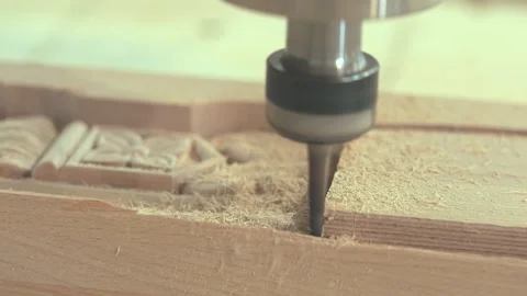 CNC machine cutting a decorative shape in a wooden part. Close-up of CNC machine Video stock 347576407