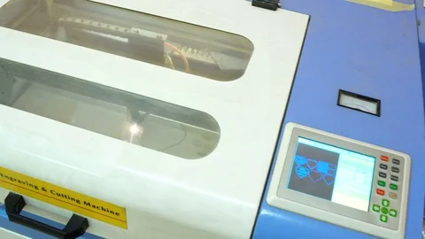 CNC machine cutting wood with a laser. CNC machine at work. Close-up. Stock Footage 82503262