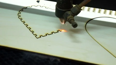 CNC machine cutting wood with a laser. CNC machine at work. Close-up. Stock Footage 82504727