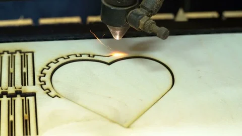 CNC machine cutting wood with a laser. CNC machine at work. Close-up. Stock Footage 82505728
