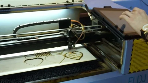 CNC machine cutting wood with a laser. CNC machine at work. Stock Footage 82506884
