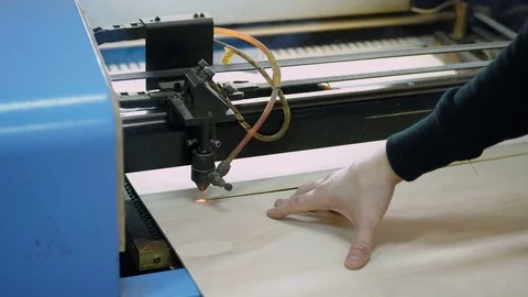 CNC machine cutting wood with a laser. CNC machine at work. Close-up. Stock Footage 82512664
