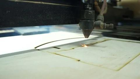 CNC machine cutting wood with a laser. CNC machine at work. Close-up. Stock Footage 82515195