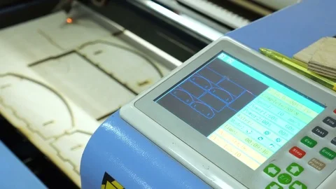 CNC machine cutting wood with a laser. CNC machine at work. Close-up. Stock Footage 82516765
