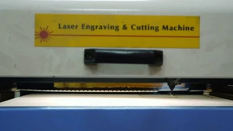 CNC machine cutting wood with a laser. CNC machine at work. Close-up. Stock Footage 82520585