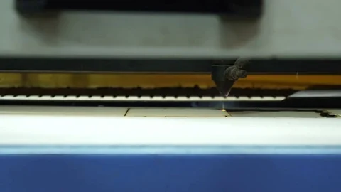CNC machine cutting wood with a laser. CNC machine at work. Close-up. Stock Footage 82522355