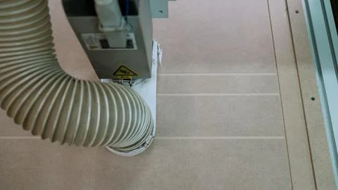 Cnc machine cutting wood panel, automated industrial process for woodworking Stock Photos