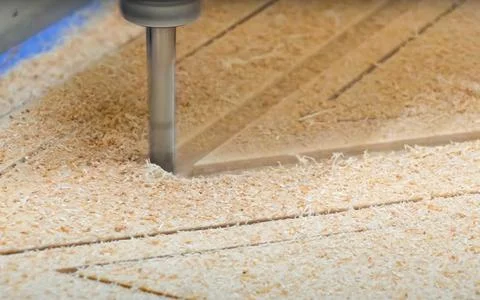 CNC machine cutting wood in workshop precision manufacturing process closeup Stock Photos