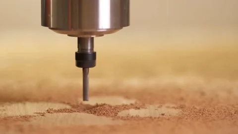 The CNC machine drills a circle in the Board. Close-up of the machine head Stock Footage 143924673