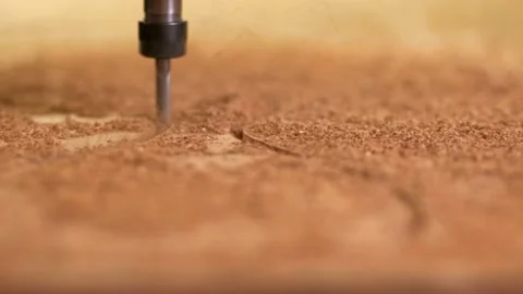 CNC machine head drill cuts out a wooden decorative item according to program Stock Footage 143925956