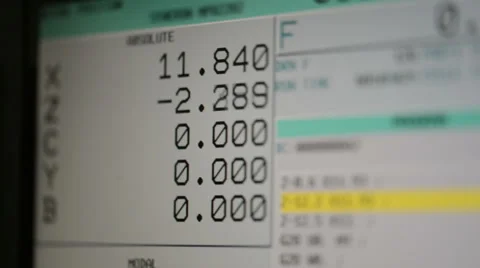 CNC machine monitor display with program code running numbers and parameters Stock Footage 49006398