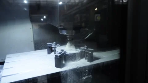 CNC machine operates on metal part with precision, automated tapping drill Stock Footage 272264875