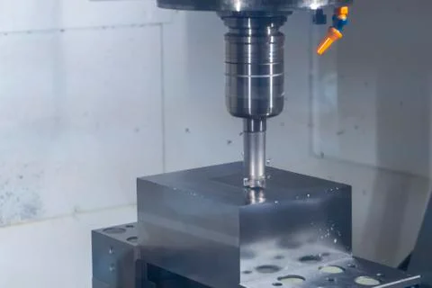 CNC machine tool cutting raw material in factory Stock-Fotos