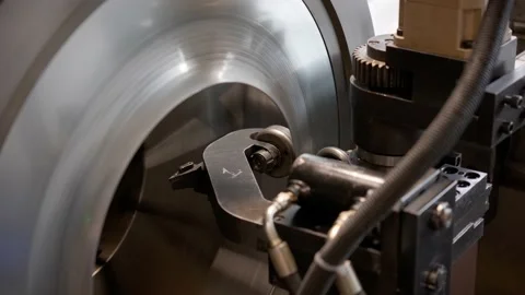 Cnc machine at work. cutting tool processing steel metal detail on turning cnc Stock Footage 231053262