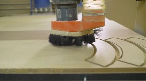 The CNC machine is working. Close-up of a numerical control machine cuts a tr Stock Photos